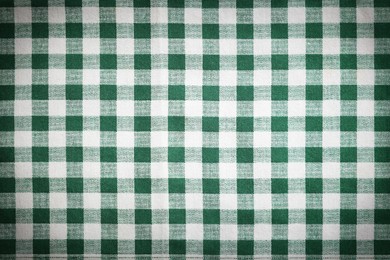 Image of Green and white tablecloth as background, vignette effect