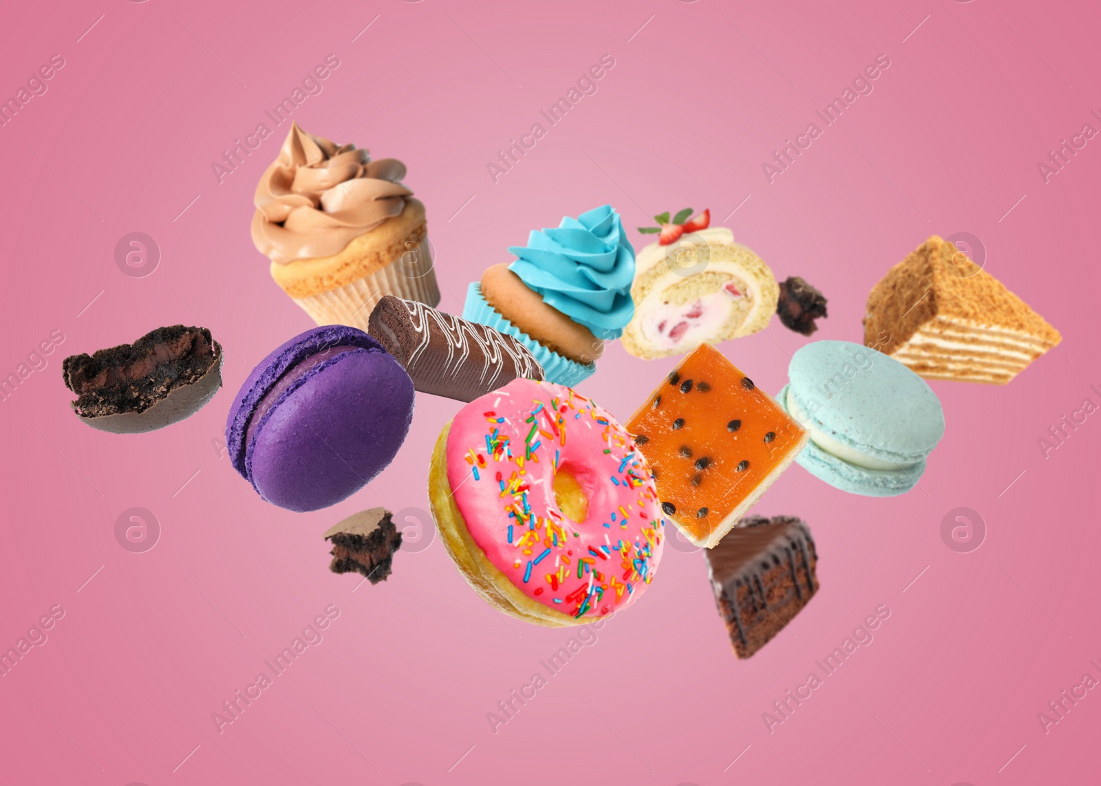 Image of Many different tasty desserts flying on pink background