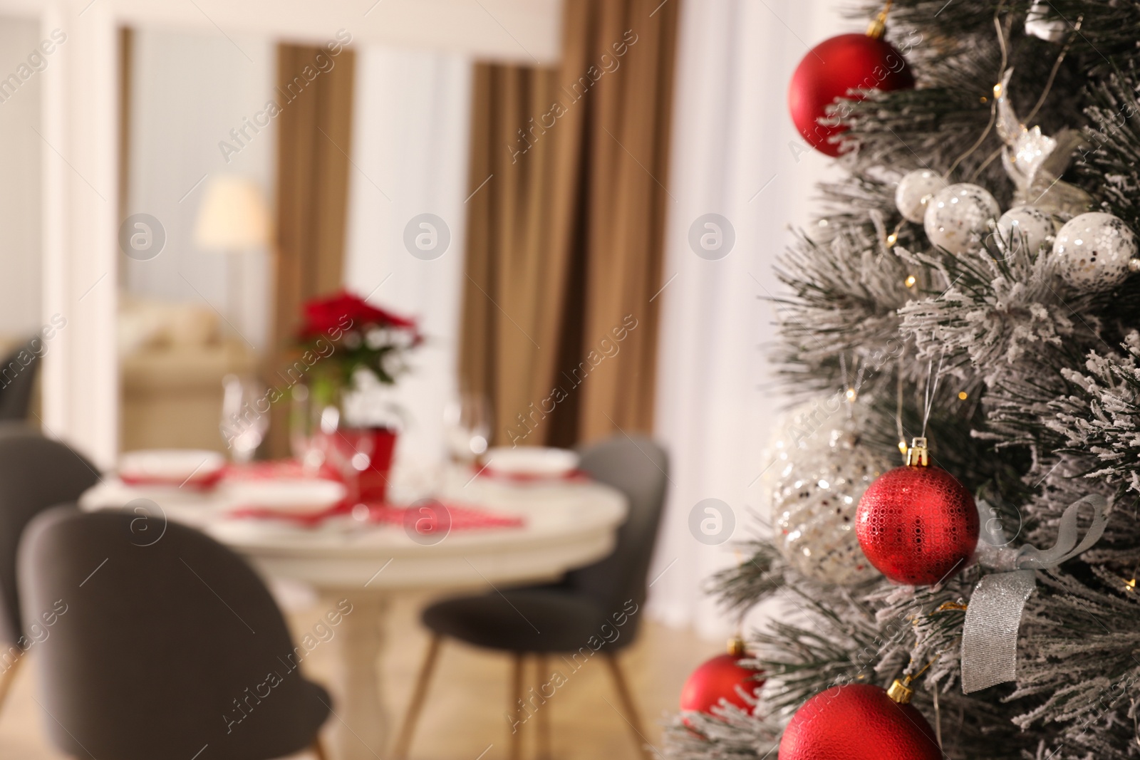 Photo of Closeup view of beautifully decorated Christmas tree indoors, space for text