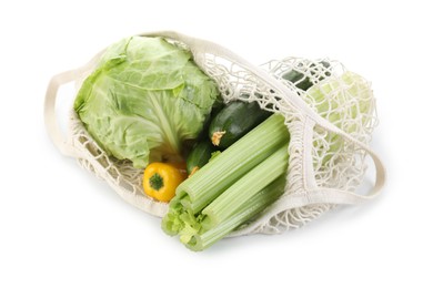 String bag with different vegetables isolated on white, top view
