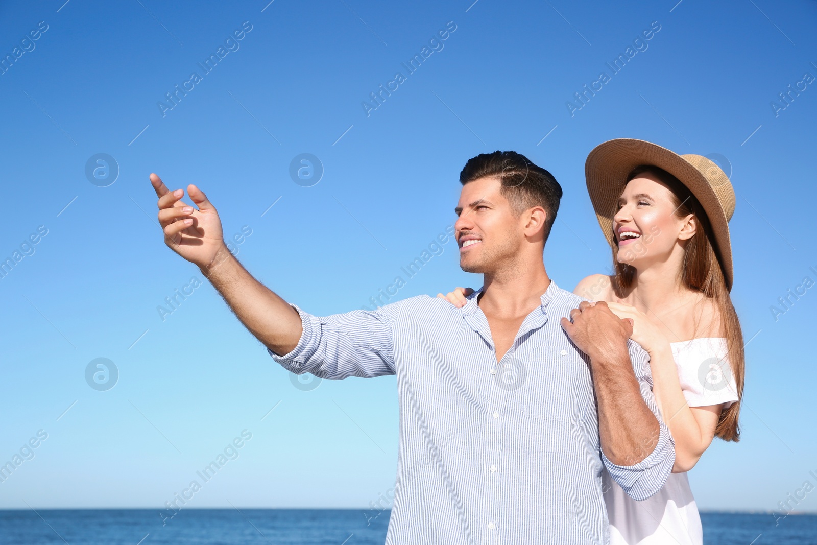 Photo of Lovely couple together on beach. Summer vacation