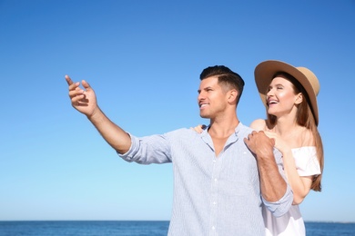 Lovely couple together on beach. Summer vacation