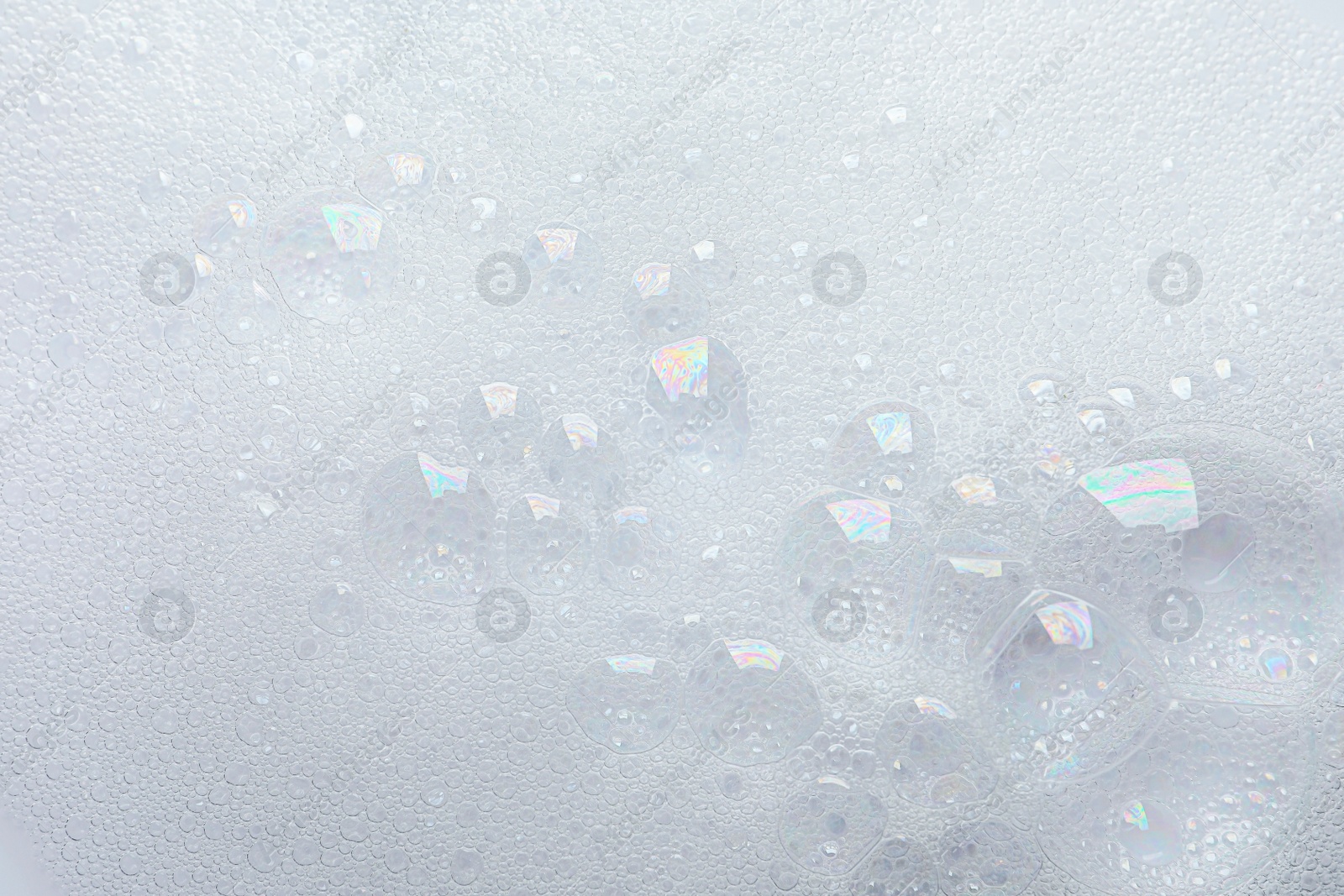 Photo of Fluffy soap foam as background, top view