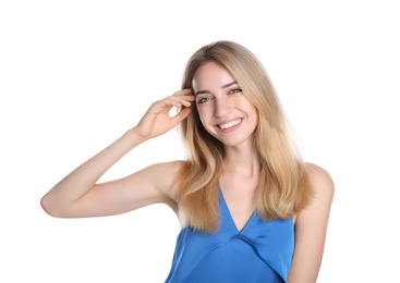 Portrait of beautiful young woman with blonde hair on white background