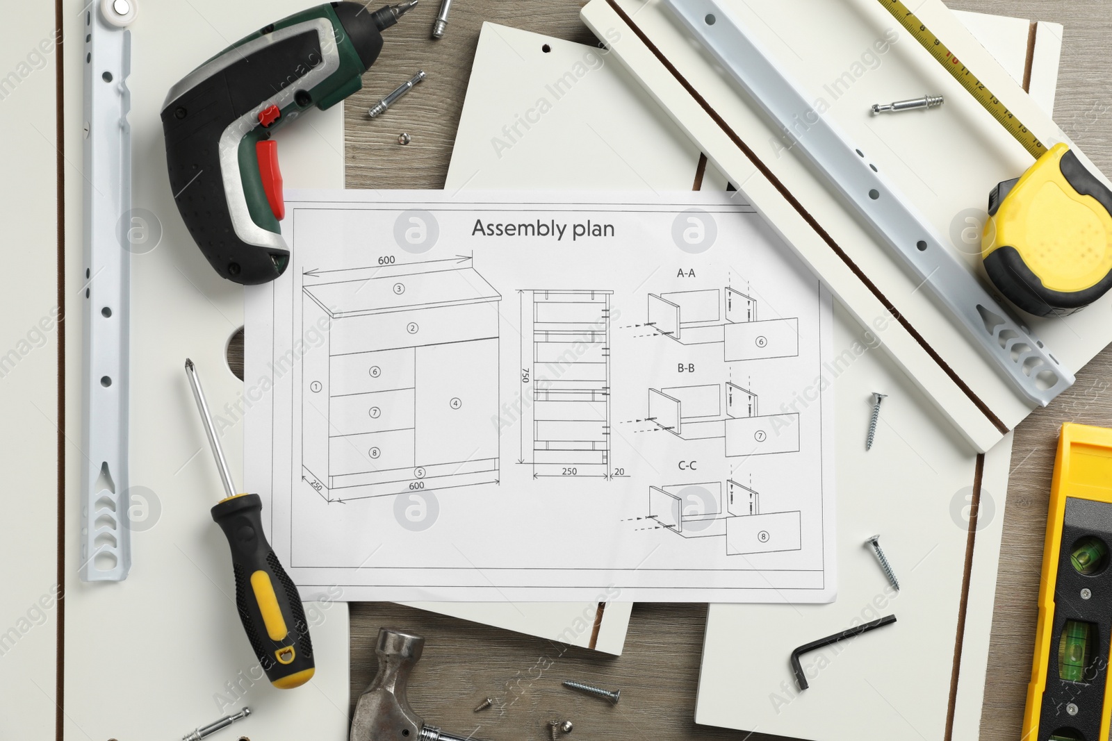 Photo of Flat lay composition with furniture parts and tools for self-assembly on wooden background