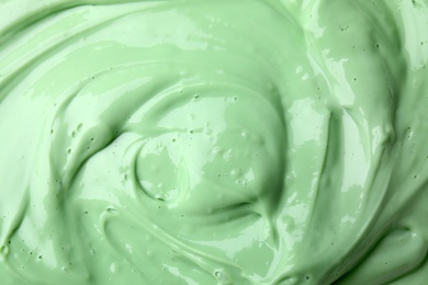 Photo of Texture of light green professional face mask as background, closeup