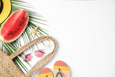 Photo of Composition with watermelon, beach accessories and space for text on white background, flat lay
