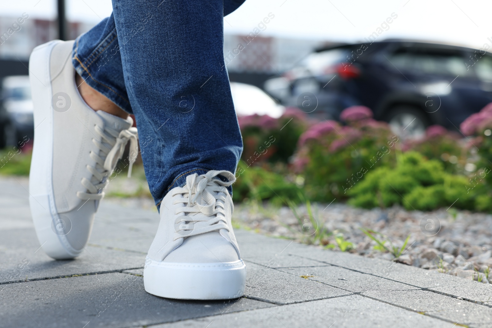 Photo of Man wearing stylish sneakers outdoors, closeup. Space for text