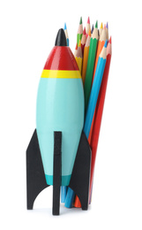 Photo of Bright modern toy rocket and pencils isolated on white. Back to school