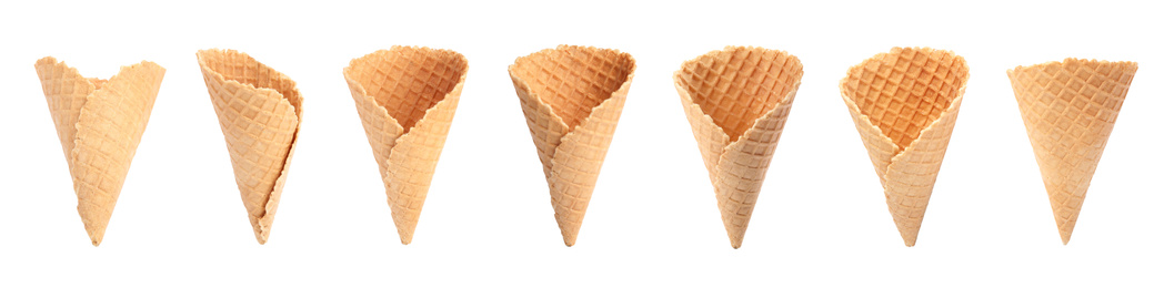 Image of Set of empty wafer ice cream cones on white background. Banner design