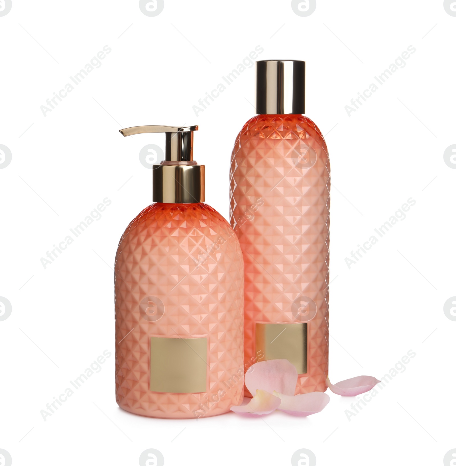 Photo of Stylish bottles with cosmetic products and petals on white background