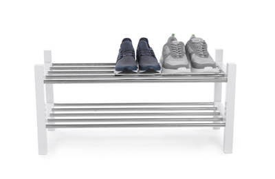 Wooden shoe shelf with sneakers isolated on white