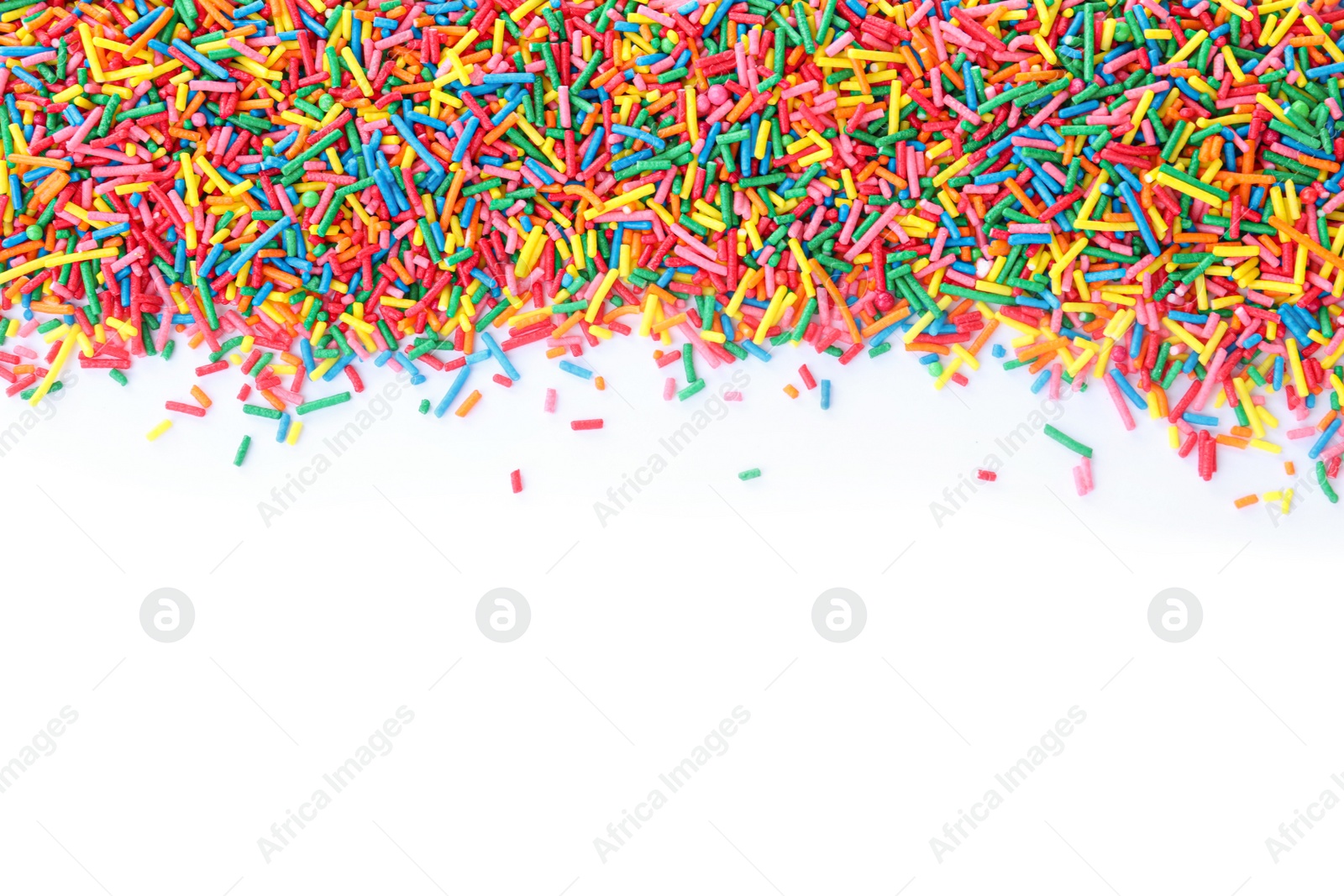 Photo of Colorful sprinkles on white background, top view. Confectionery decor