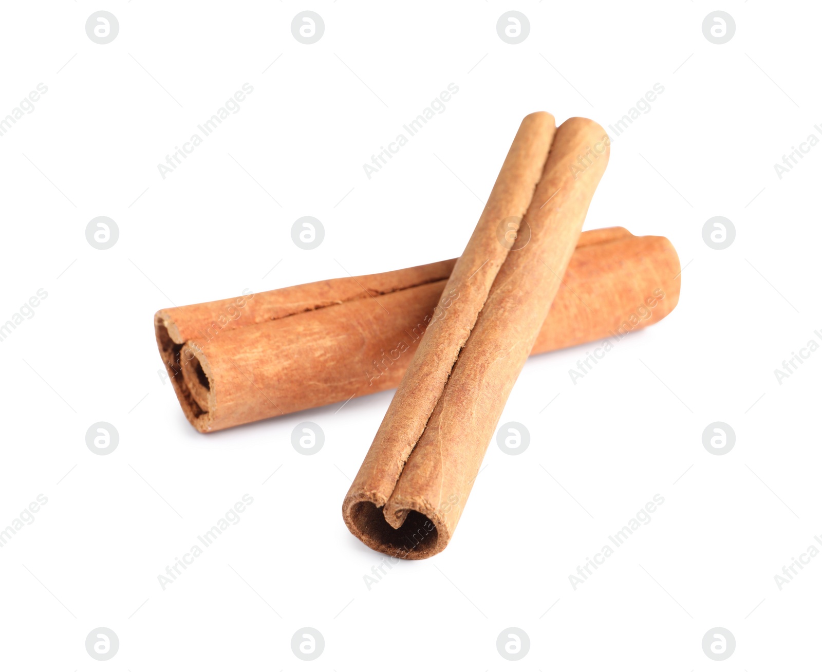 Photo of Two aromatic cinnamon sticks isolated on white