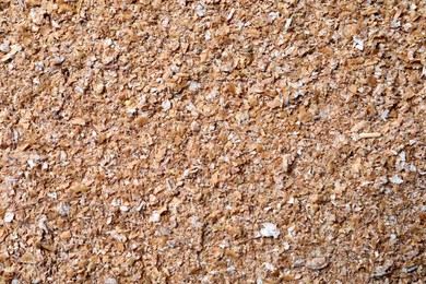 Photo of Heap of wheat bran as background, top view