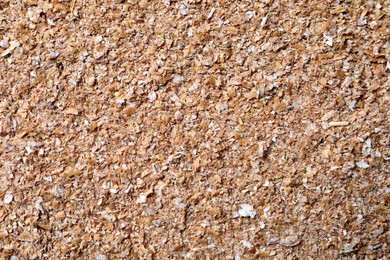 Heap of wheat bran as background, top view