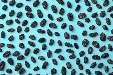 Photo of Flat lay composition with raisins on color background. Dried fruit as healthy snack