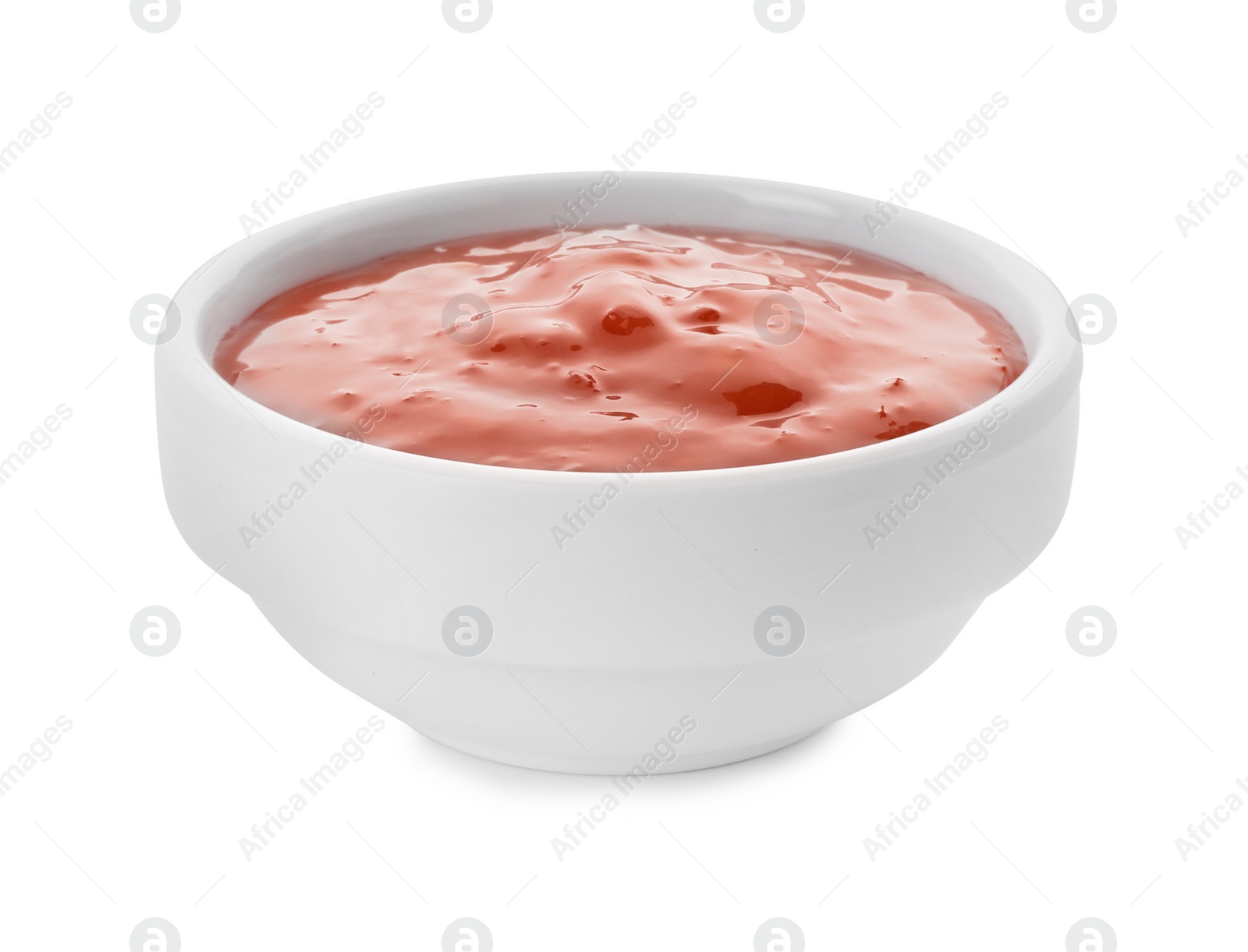Photo of Tasty chili sauce in bowl isolated on white