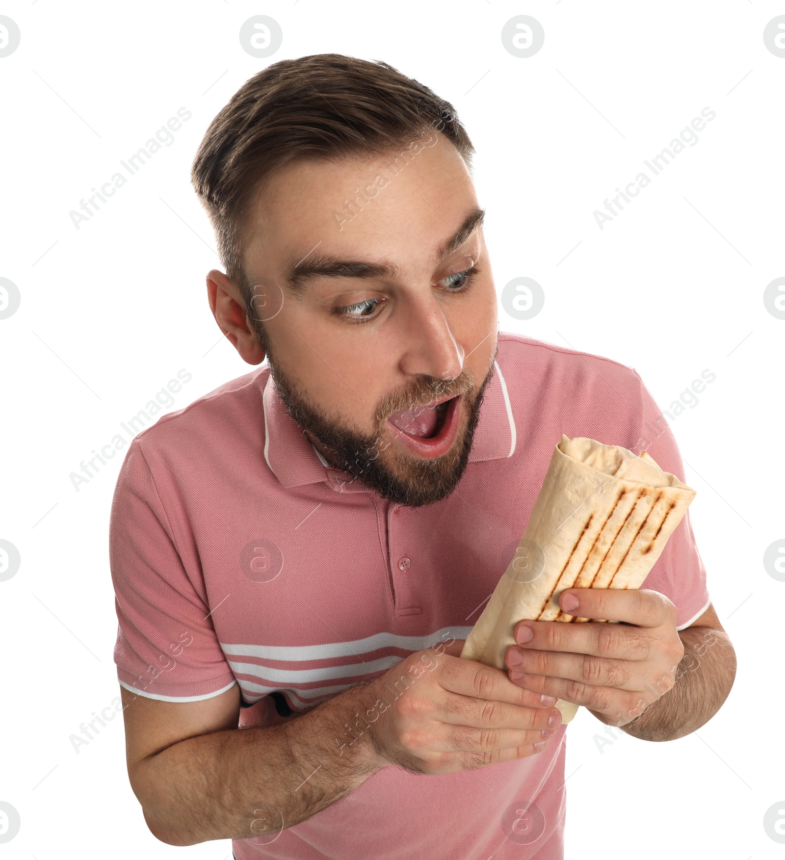 Photo of Emotional young man with delicious shawarma on white background