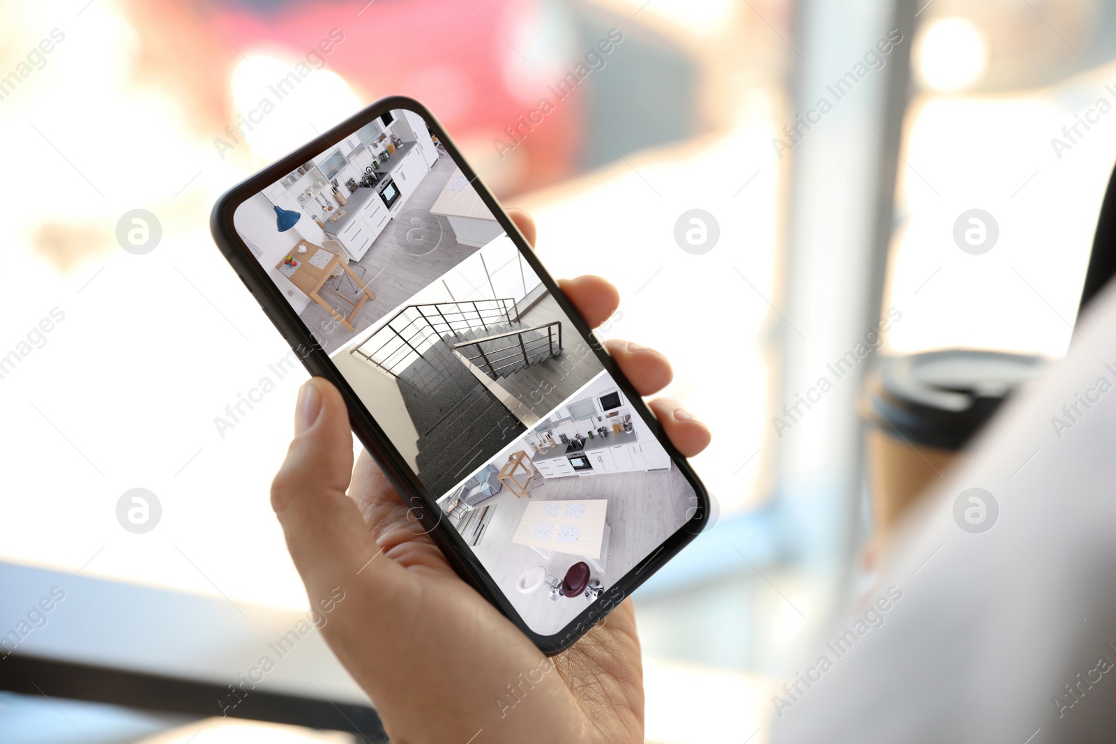 Image of Woman monitoring modern cctv cameras on smartphone indoors, closeup. Home security system