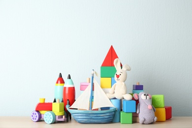 Set of different toys on wooden table