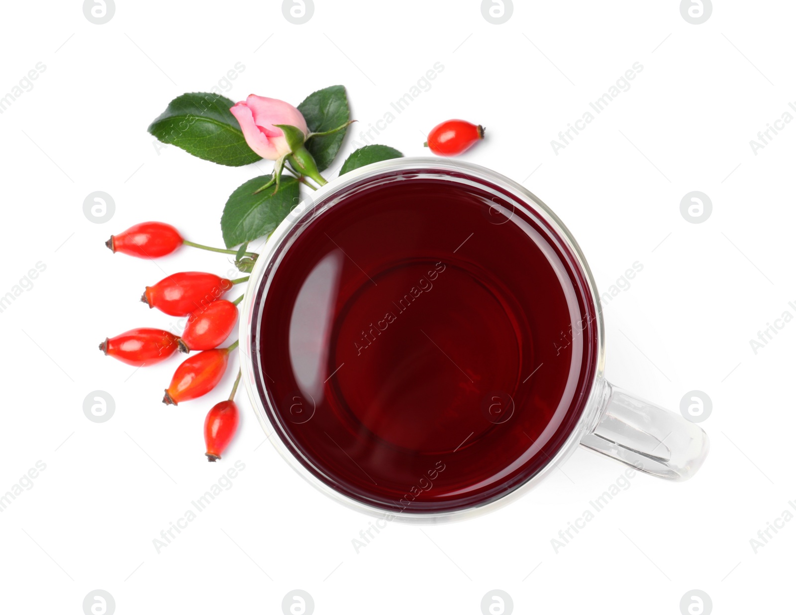 Photo of Aromatic rose hip tea, flower and fresh berries on white background, top view