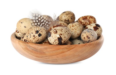 Bowl with speckled quail eggs and feathers isolated on white