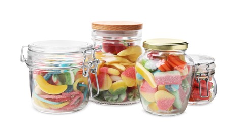 Photo of Jars with tasty jelly candies on white background