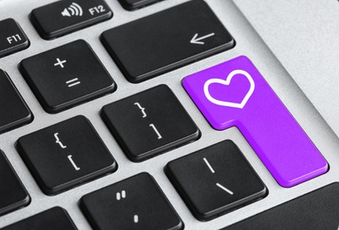 Image of Love button on laptop keyboard, closeup. Online dating site