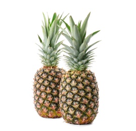 Photo of Fresh pineapples on white background