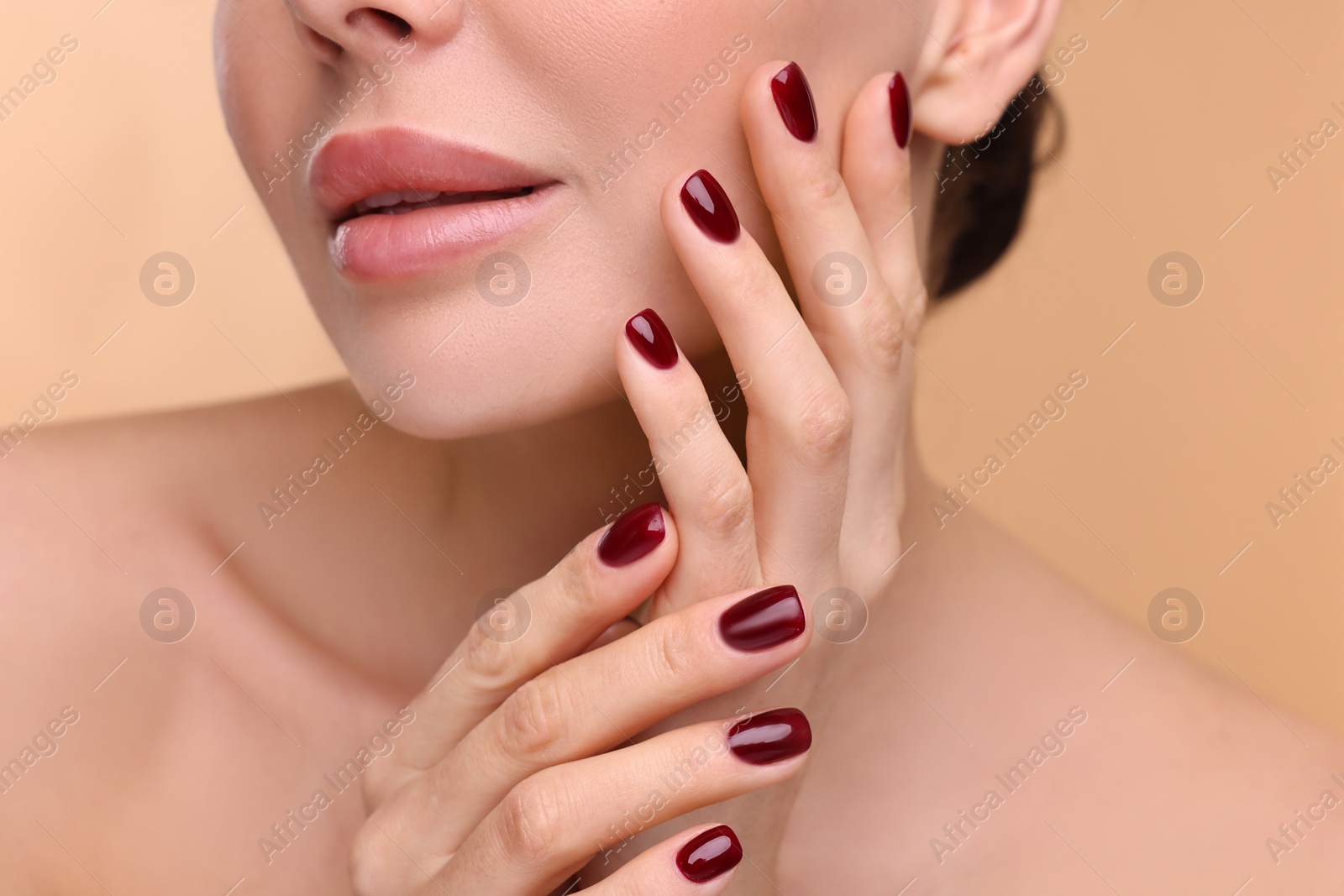 Photo of Woman with beautiful lips on beige background, closeup