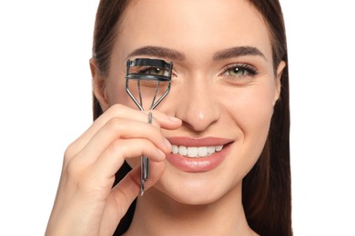 Photo of Woman using eyelash curler on white background