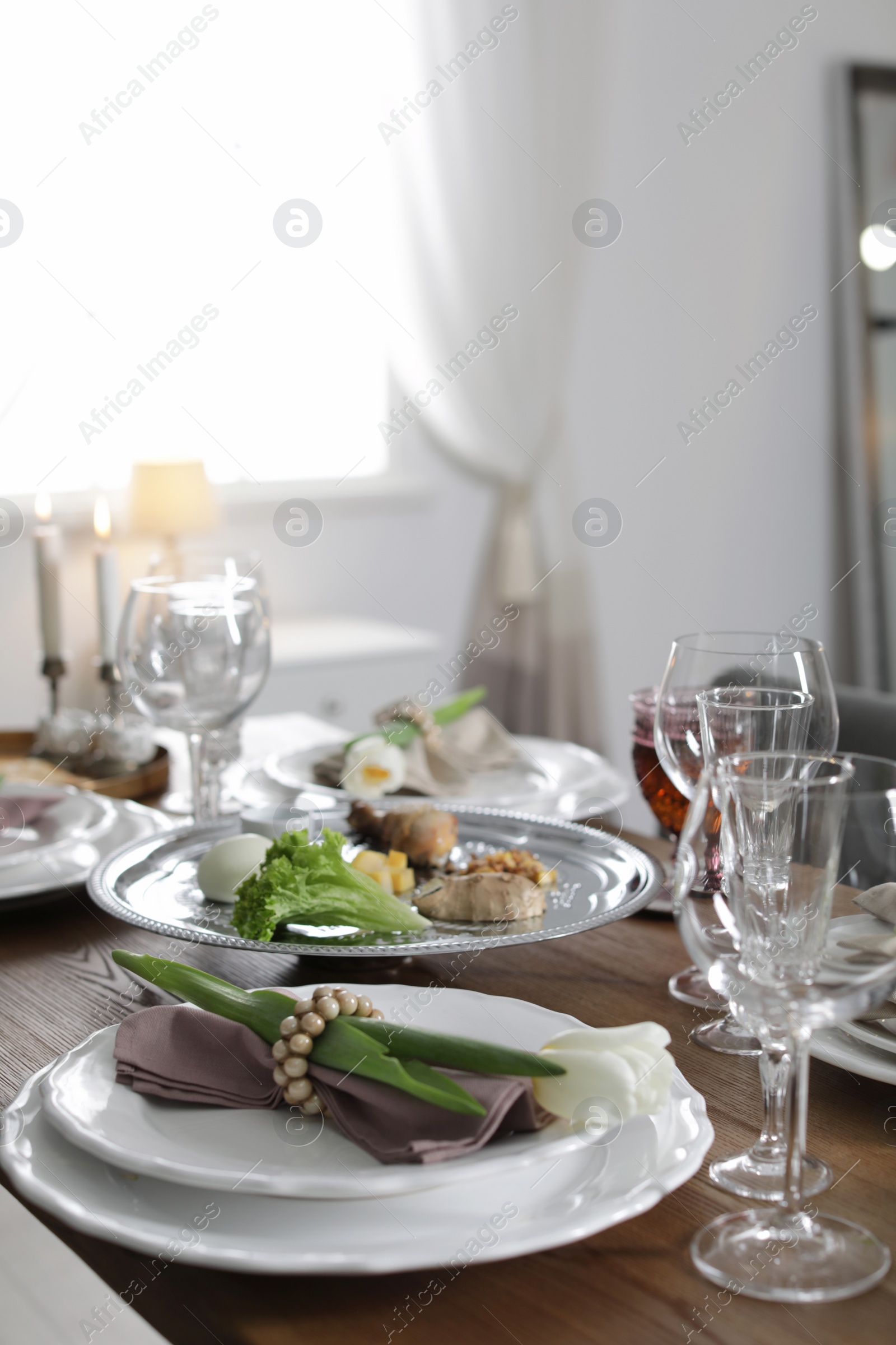 Photo of Festive Passover table setting at home. Pesach celebration