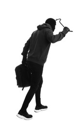 Man wearing black balaclava with backpack and crowbar on white background