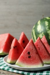 Photo of Delicious fresh watermelon slices with seeds on table