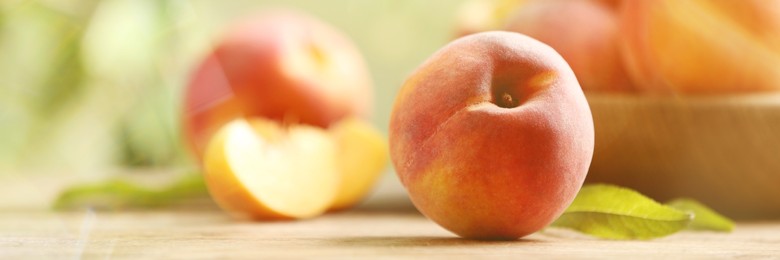 Fresh ripe peach on table, closeup. Banner design with space for text