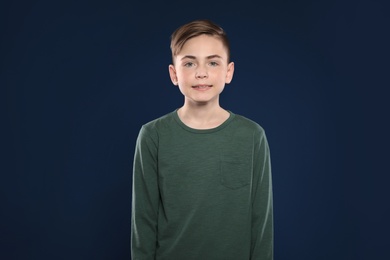 Photo of Portrait of little boy on color background