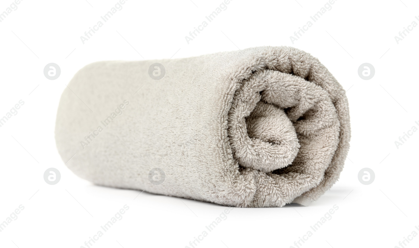Photo of Rolled clean beige towel on white background