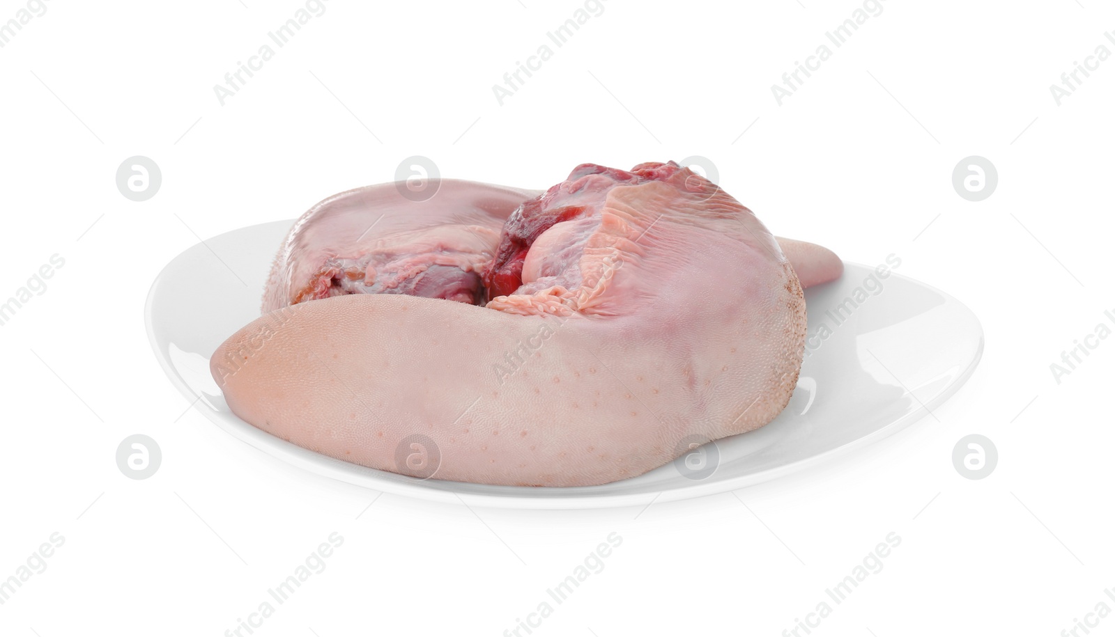 Photo of Plate with raw beef tongues on white background