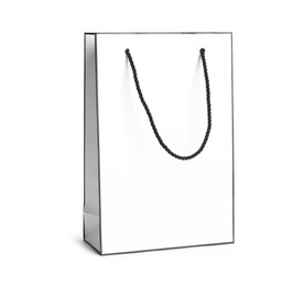 Photo of Paper shopping bag with handles on white background. Mockup for design