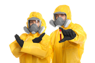 Photo of Man and woman in chemical protective suits with test tube of blood sample on white background. Virus research