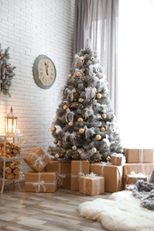Photo of Stylish interior of living room with decorated Christmas tree