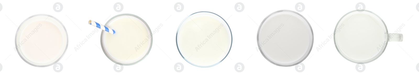 Image of Set with glasses of fresh milk on white background, top view. Banner design