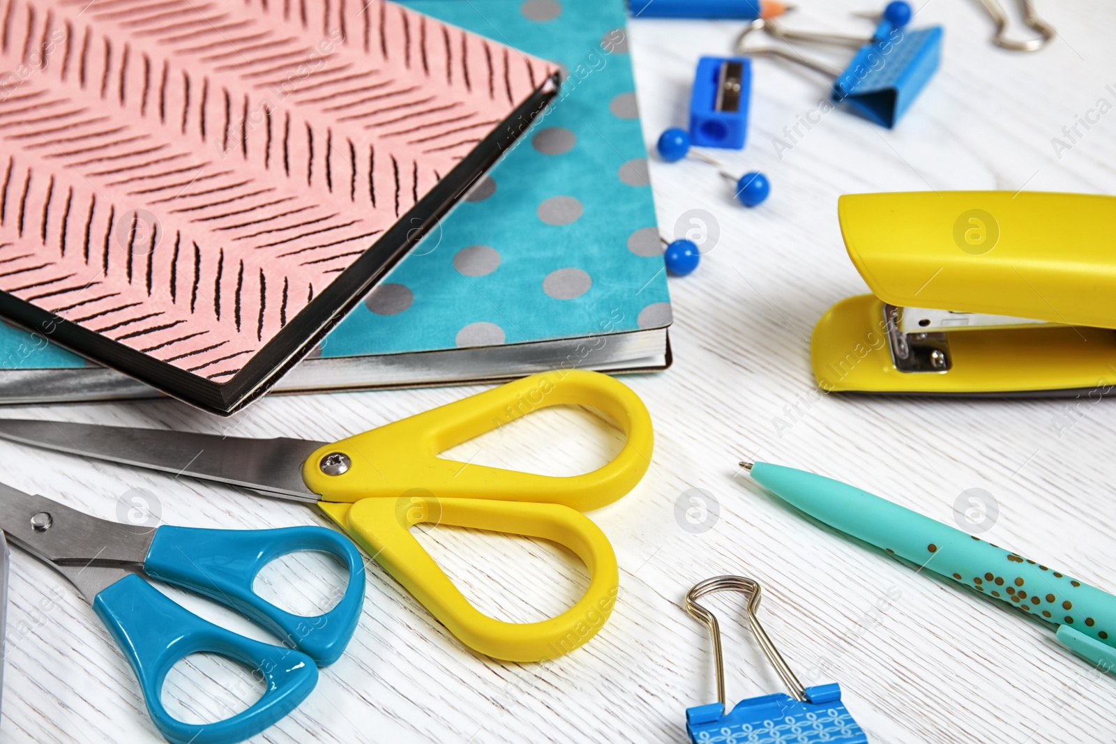 Photo of Different stationery on wooden table. Back to school