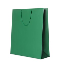 Photo of One green shopping bag isolated on white