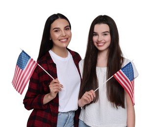 4th of July - Independence day of America. Happy mother and daughter with national flags of United States on white background