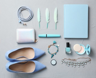 Photo of Set of accessories, cosmetics and shoes on grey background, flat lay