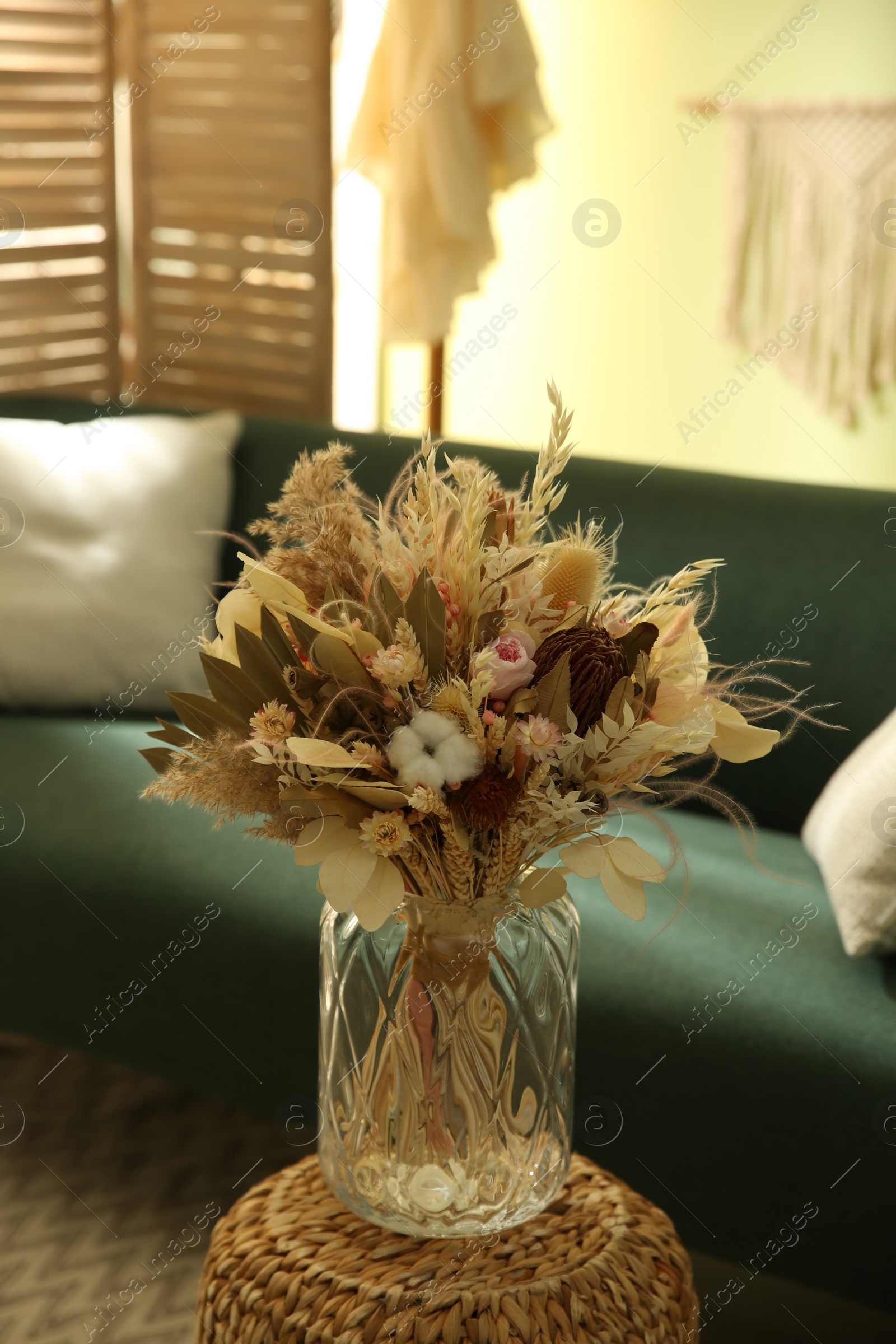 Photo of Bouquet of dry flowers and leaves in living room