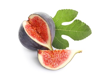 Photo of Cut purple fig with leaf on white background