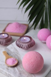 Beautiful composition with aromatic bath bombs on table